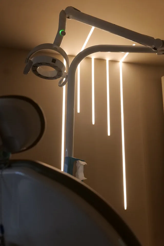 Dentist reviewing x-rays with a patient during an examination at Cobham Dental